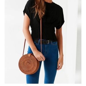 Round woven crossbody bag
